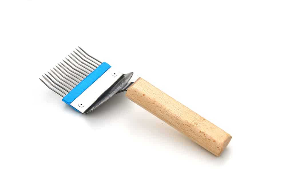 أداة خدش الشمع